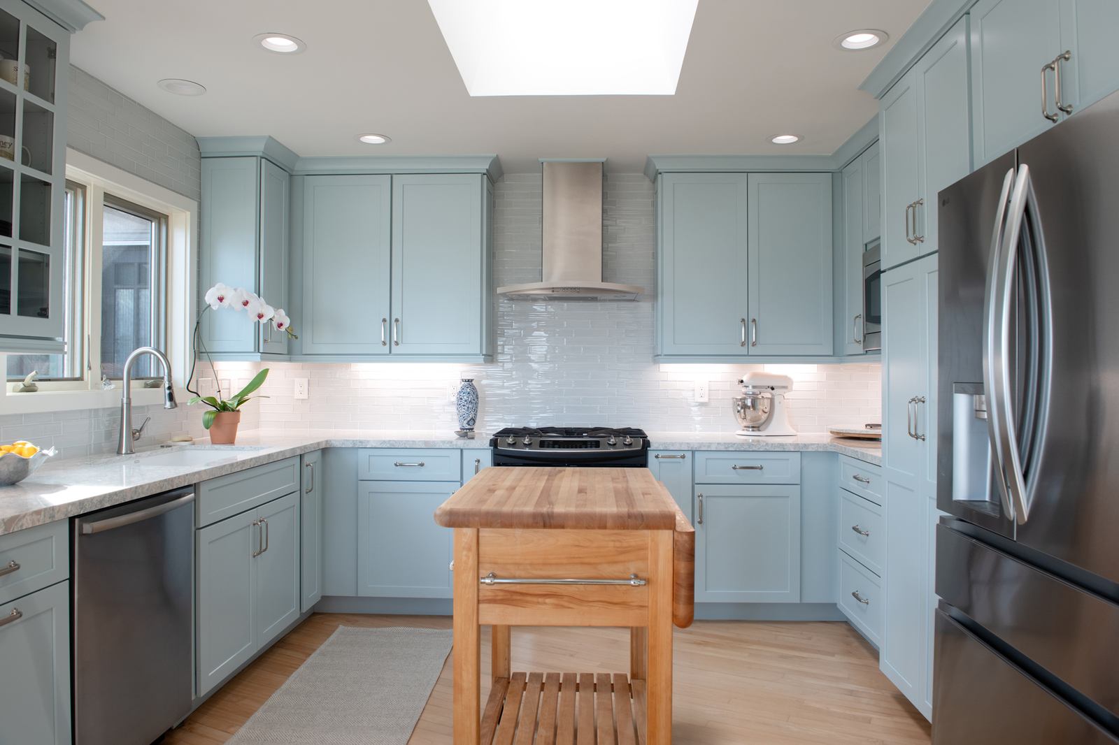 Point Loma kitchen remodel with custom blue cabinetry, quartz counters and stainless appliances
