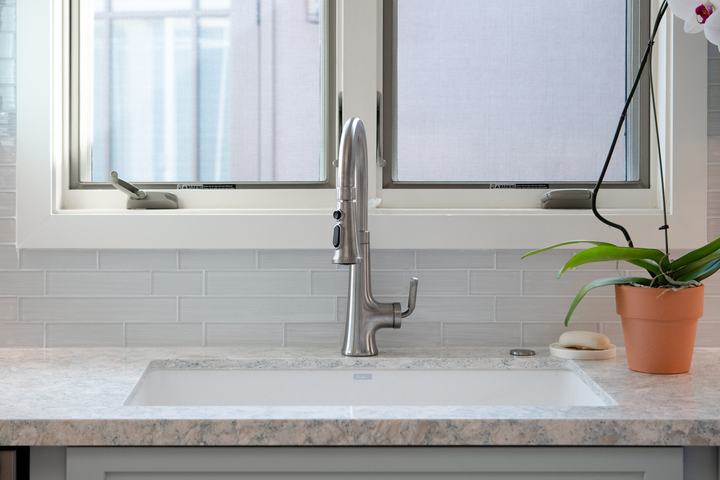 Blanco Grandis sink with Kohler Tone pull-down faucet set into Cambria Montgomery quartz