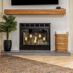 Shiplap fireplace with wood mantel and tile hearth
