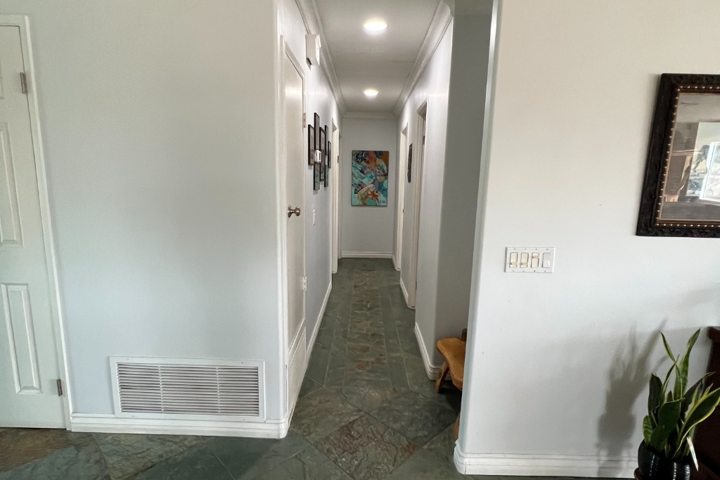 Bay Park home before reconfiguration showing boxed-in mid-century rooms