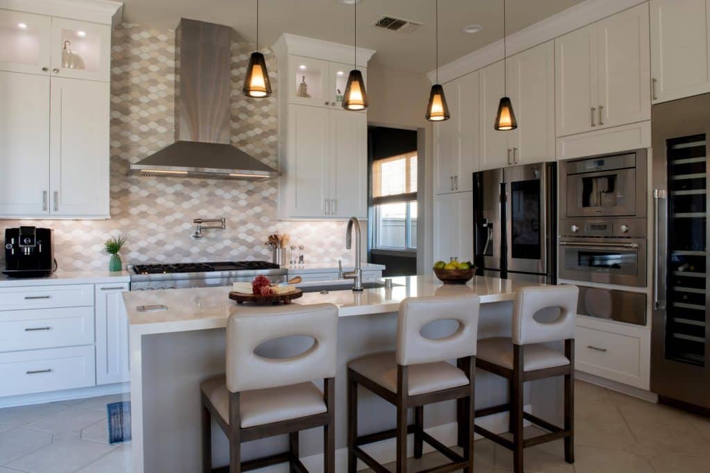 Built-in steam oven in a modern kitchen with white cabinets
