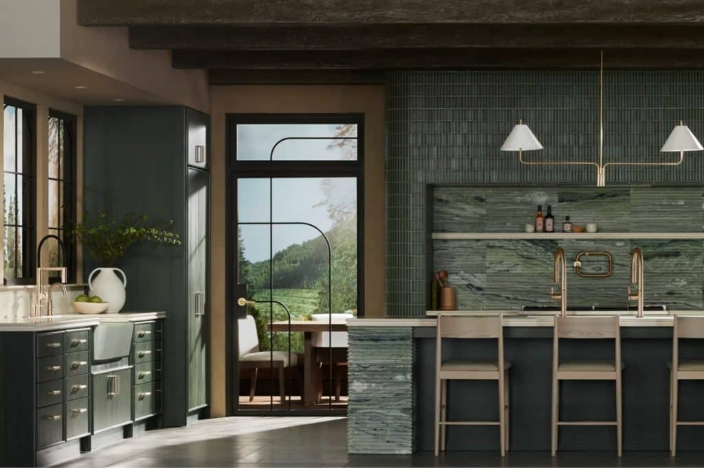 Color drenched kitchen featuring coordinated green tones across walls, cabinetry, and tile backsplash