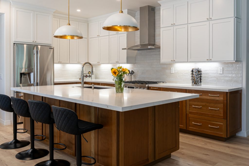 Kitchen with warm wood cabinets and white uppers