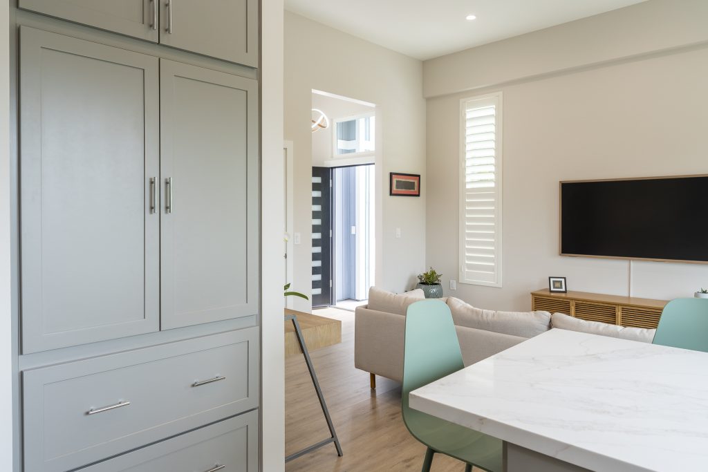 Tall pantry cabinets with view to entry and living