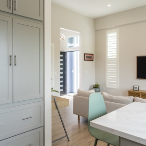 Tall pantry cabinets with view to entry and living