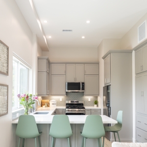 ADU kitchen with peninsula seating and recessed lighting