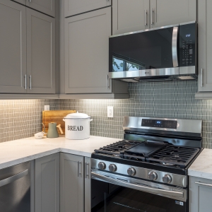 Corner view of quartz counters and stainless range