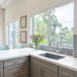 Undermount Silgranit sink below window and tile splash