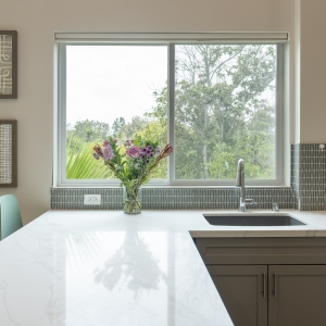 Large window over sink and extended peninsula counter