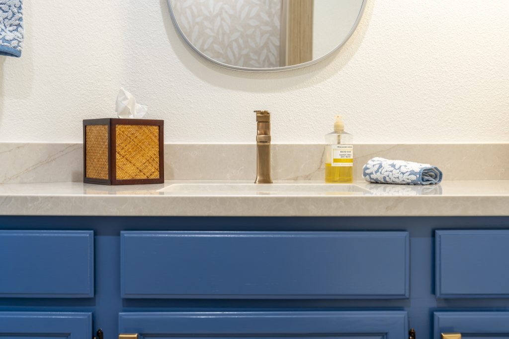 Close-up of Delta Velum single-hole faucet on MSI Lumataj quartz