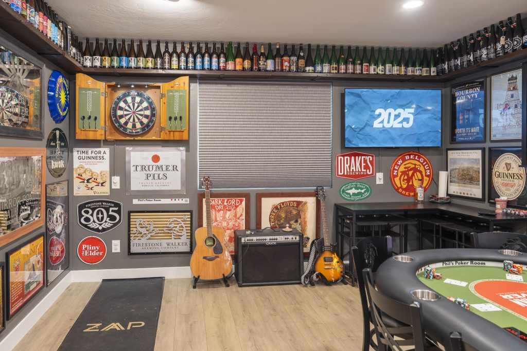 Dartboard corner with guitars and amplifier display