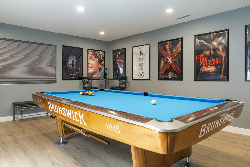 Brunswick pool table with cinema poster wall