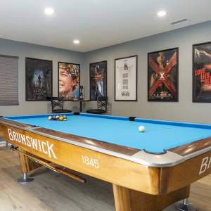 Brunswick pool table with cinema poster wall