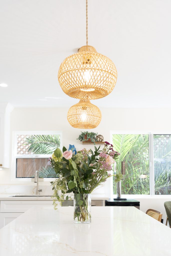 Island view with seagrass pendants and brass hardware