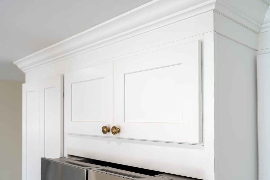 Crown moulding above built-in refrigerator surround