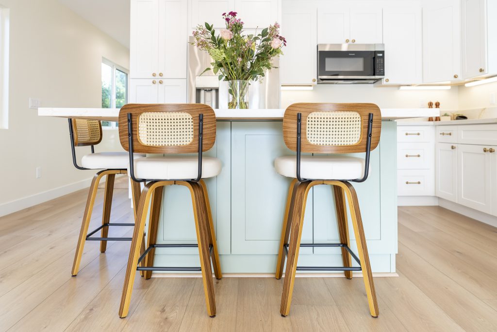 Island seating with soft green base and cane stools