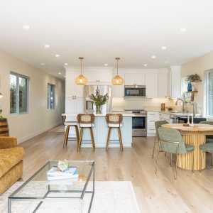 Open kitchen with island seating and coastal palette in Pacific Beach