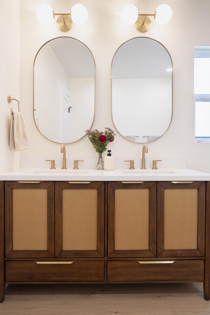 Woven-front vanity doors with brass finger pulls