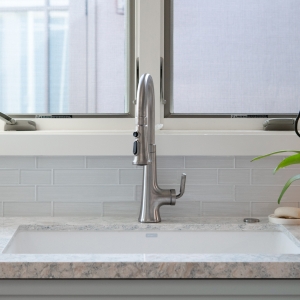 Blanco Grandis sink with Kohler Tone pull-down faucet set into Cambria Montgomery quartz
