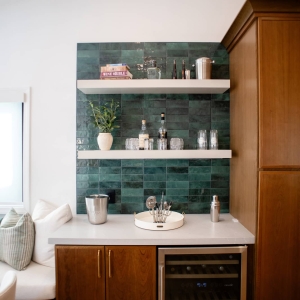 Beverage station with green backsplash and beverage fridge