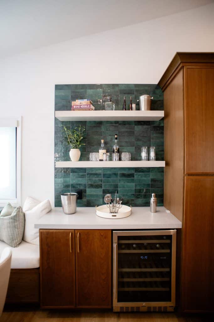 Beverage station with green backsplash and beverage fridge
