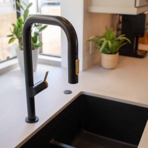 Black faucet and undermount kitchen sink