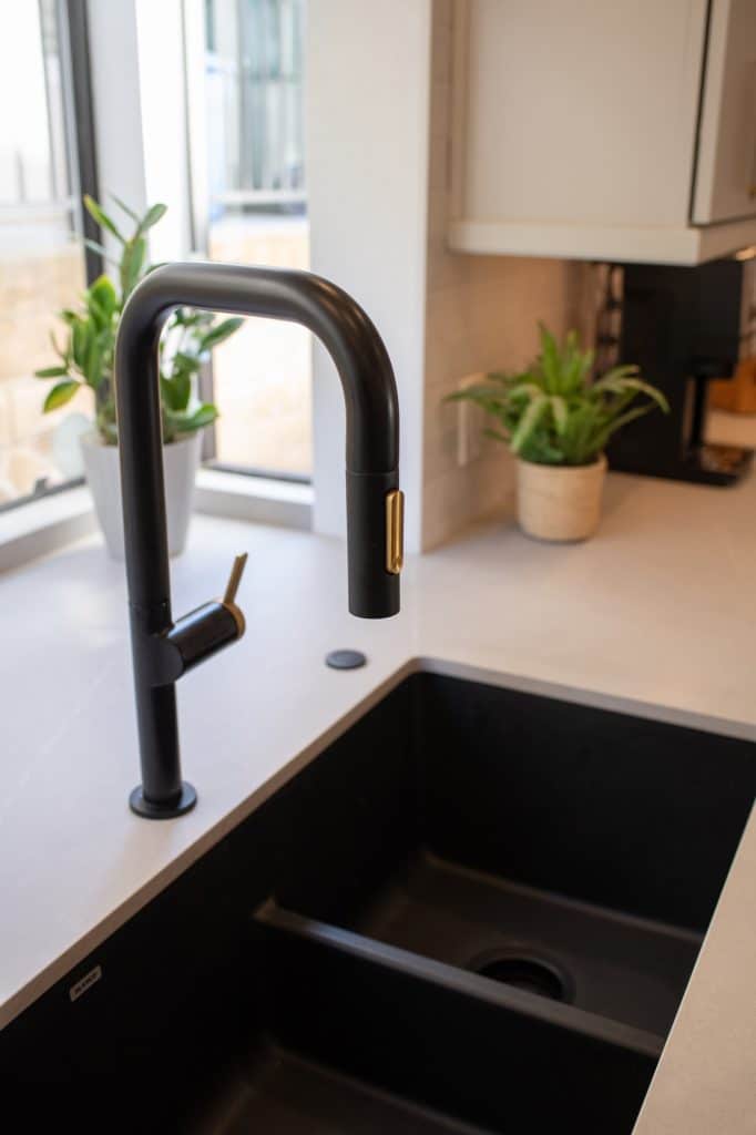 Black faucet and undermount kitchen sink