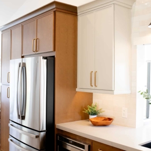 Refrigerator, microwave drawer, and surrounding cabinetry