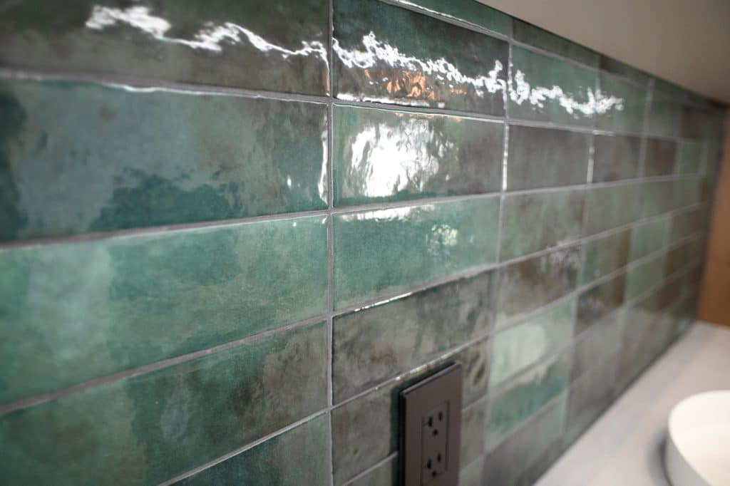 Close-up of the green ceramic backsplash tile