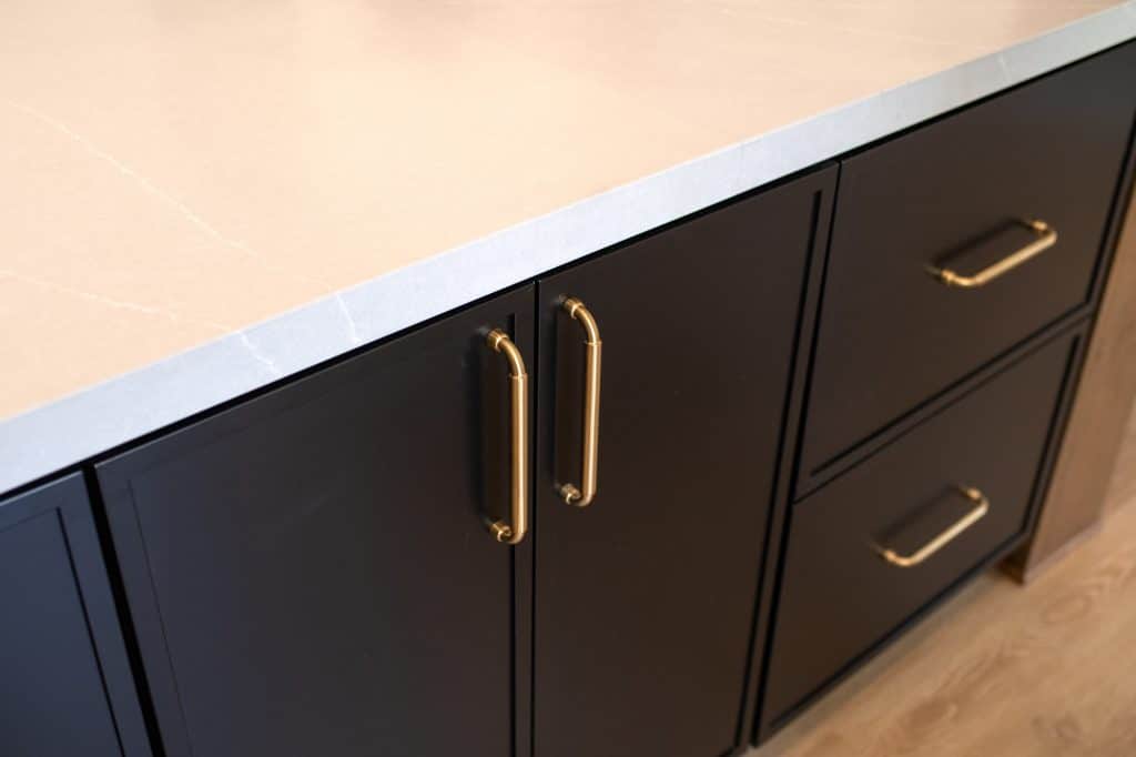 Brass hardware on the kitchen island cabinets