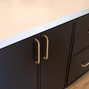 Brass hardware on the kitchen island cabinets