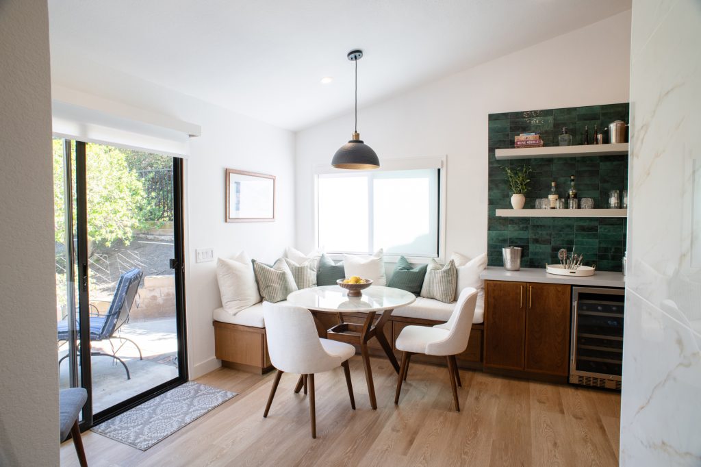 Breakfast nook with banquette seating and beverage station
