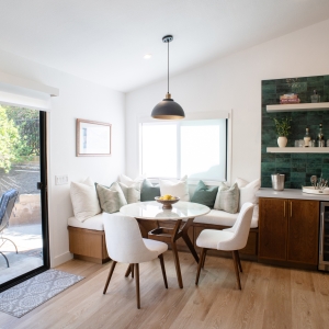 Breakfast nook with banquette seating and beverage station