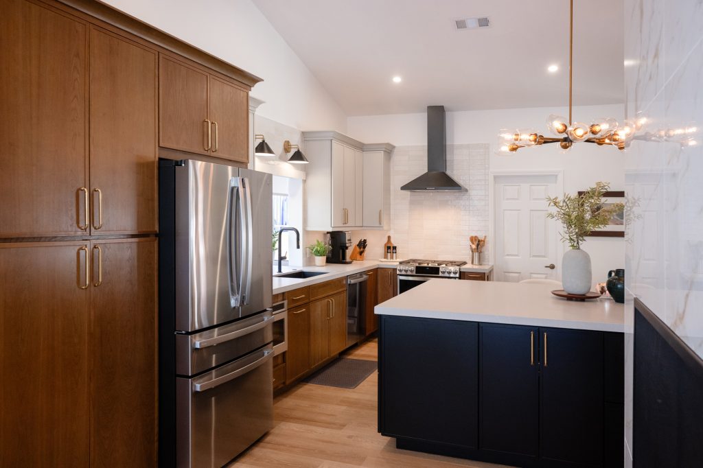 Kitchen with mixed-tone cabinets and oversized island