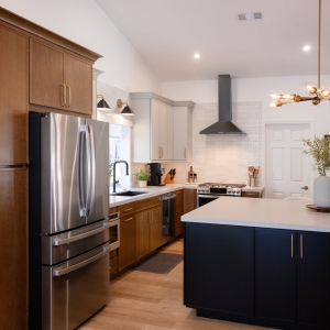 Kitchen with mixed-tone cabinets and oversized island