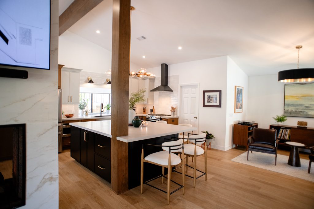 Open kitchen and family room with fireplace and island
