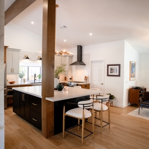 Open kitchen and family room with fireplace and island