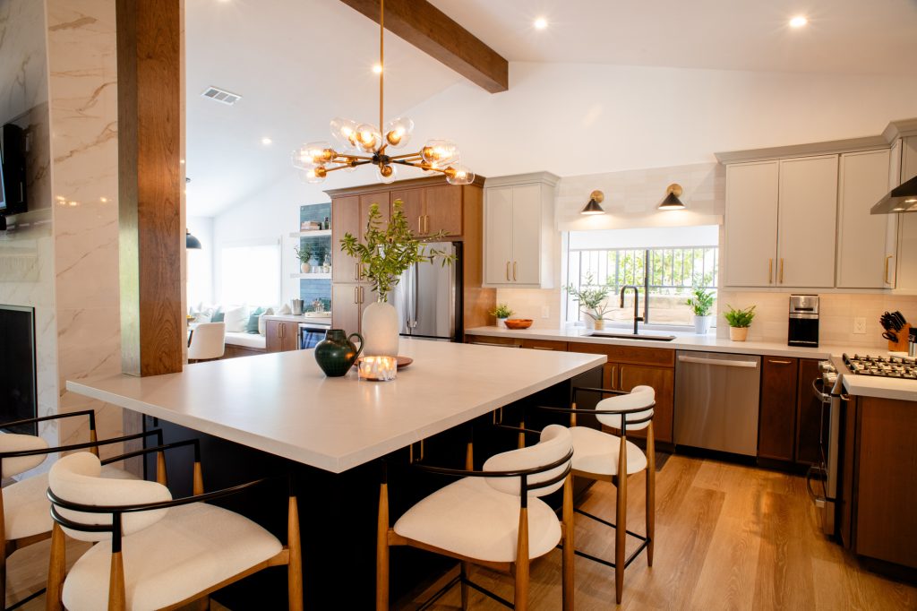 Open kitchen with large island, fireplace, and breakfast nook