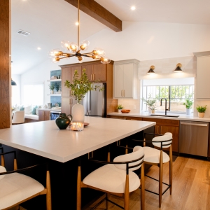 Open kitchen with large island, fireplace, and breakfast nook
