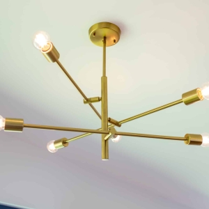 Gold chandelier lighting in the open dining area