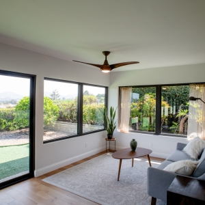 Bright sitting area with large windows and white oak flooring