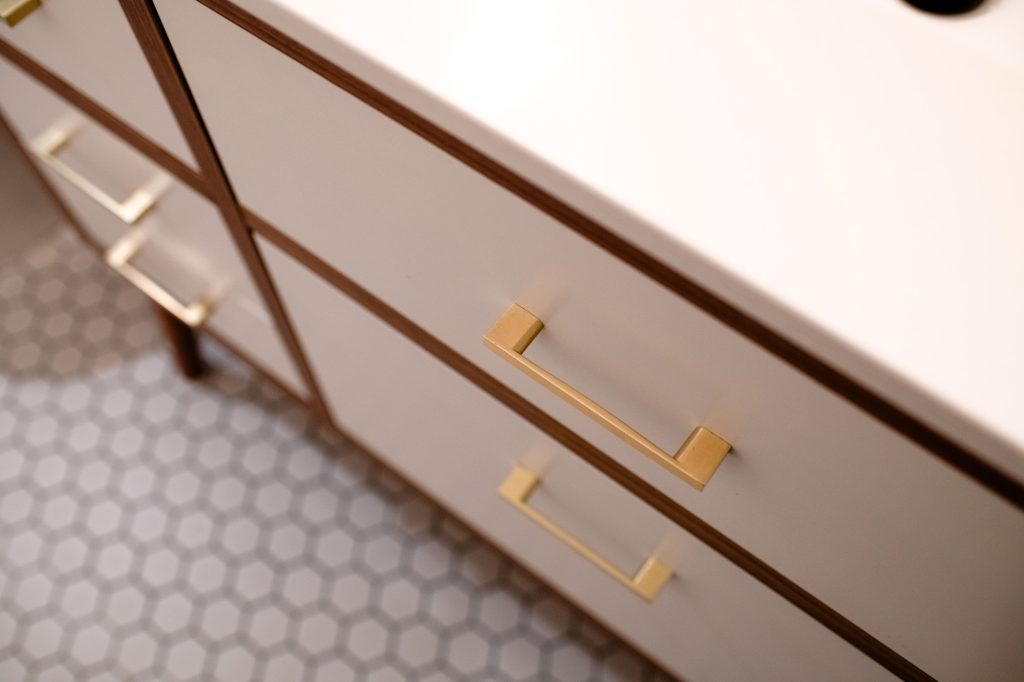 Brass drawer pulls on the hall bathroom vanity