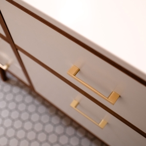 Brass drawer pulls on the hall bathroom vanity