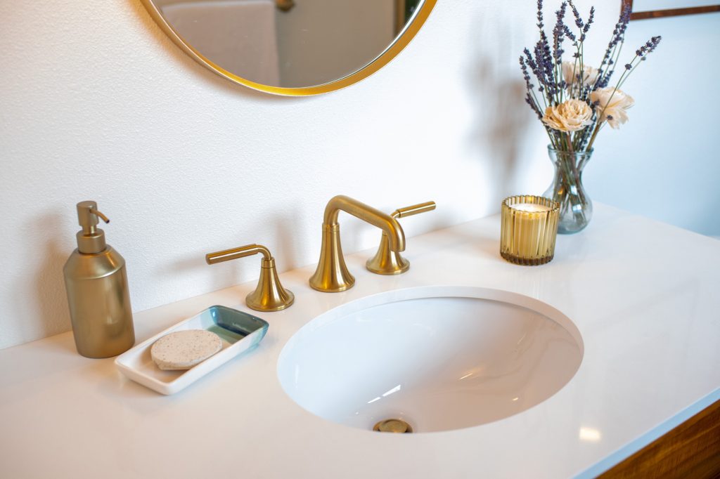 Primary bathroom sink and brass faucet