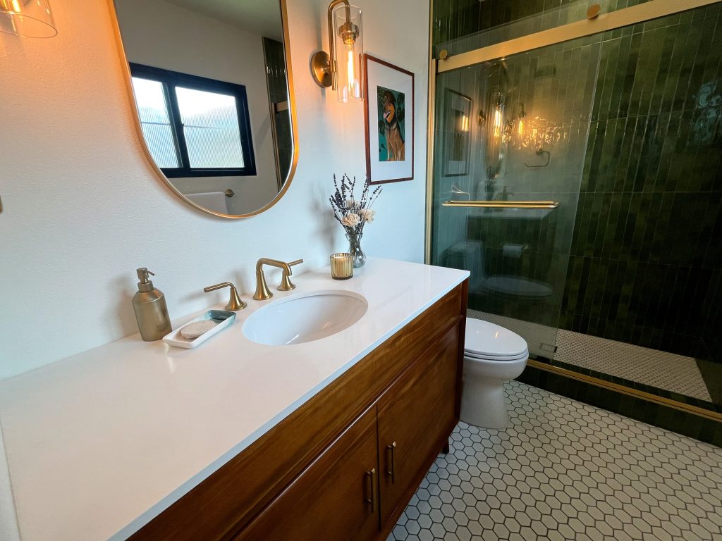 Wide view of the primary bathroom vanity and shower