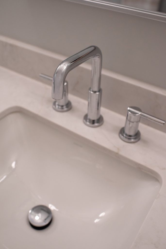 Chrome widespread faucet at a rectangular undermount sink, seen from above