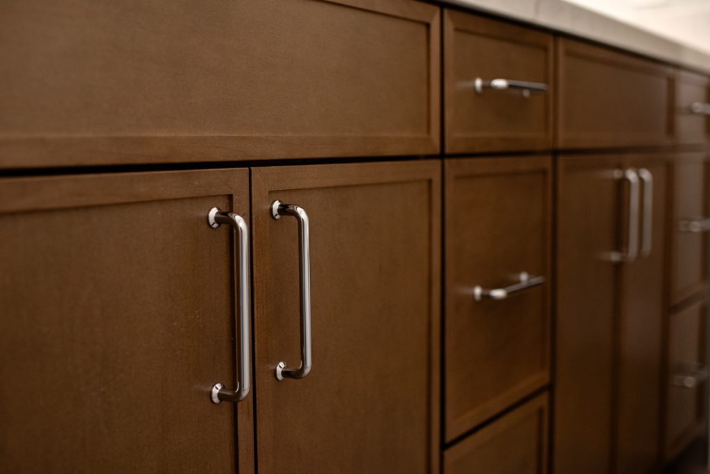Cabinet doors and drawers in Maple Latte with polished chrome bar pulls