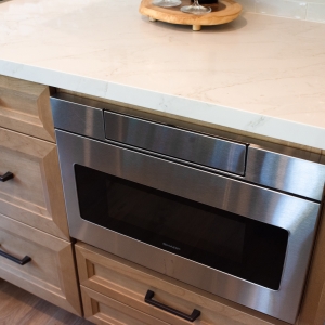 Stainless microwave drawer built in below the quartz countertop