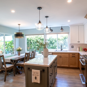 Kitchen looking toward the banquette and patio doors past the island